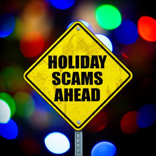 Yellow road sign reading, "Holiday Scams Ahead."